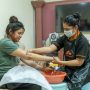 The Photo Shows a lady from Nagpur City getting Manicure service at her home bleach facial kit